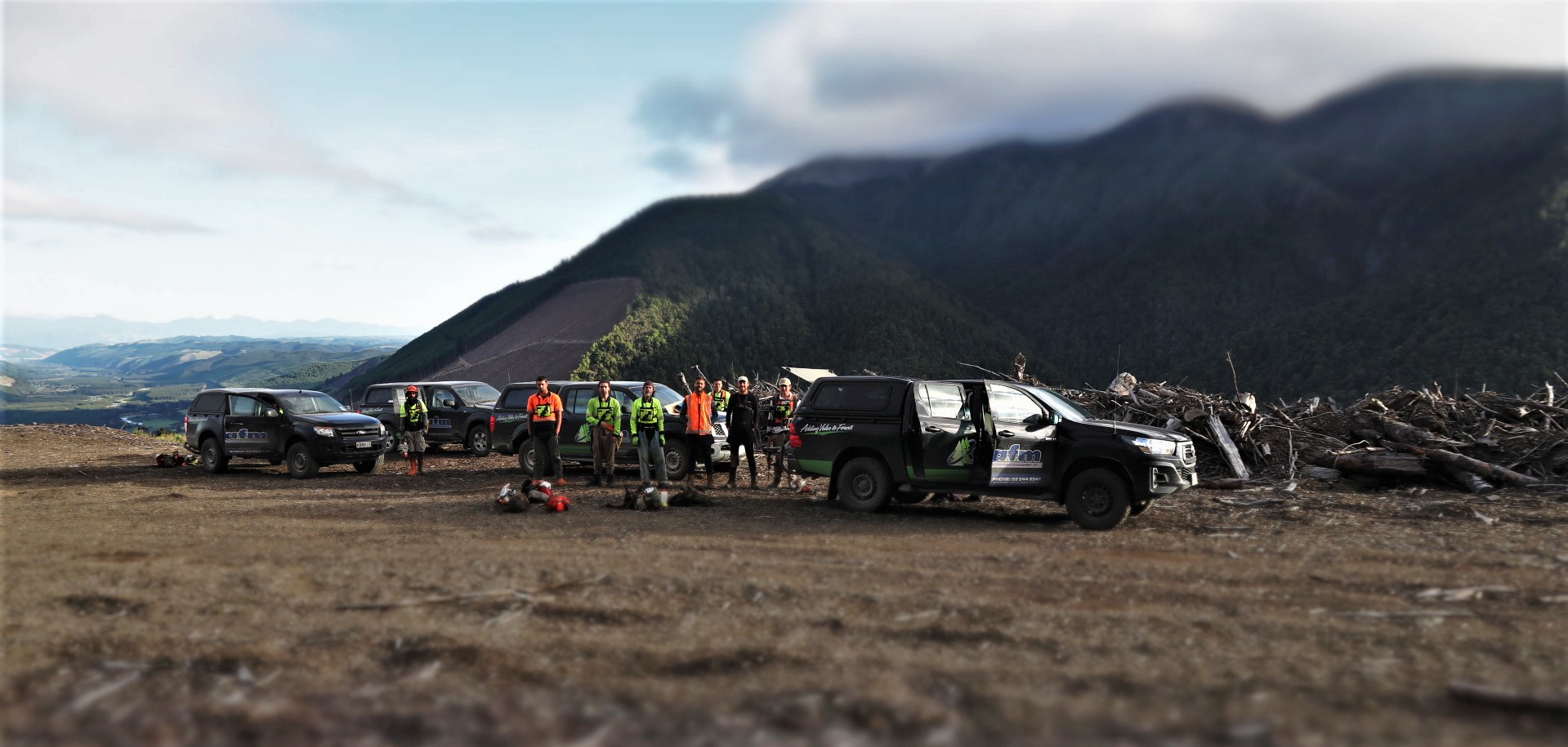 Utes and people at skid sites